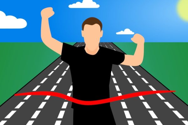 man crossing finish line | A. T. Baron - Author & Illustrator