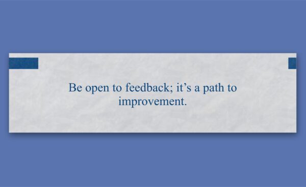 A white rectangular box on a blue background contains the text: "Be open to feedback; it’s a path to improvement.