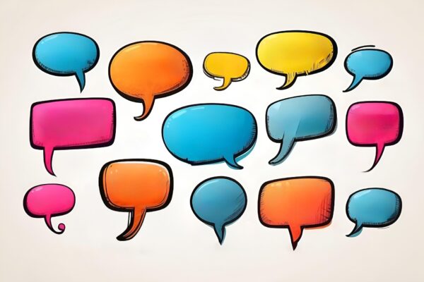 Colorful speech bubbles in various shapes and sizes, including pink, blue, orange, and yellow, are scattered across a light background, creating a lively and expressive visual.